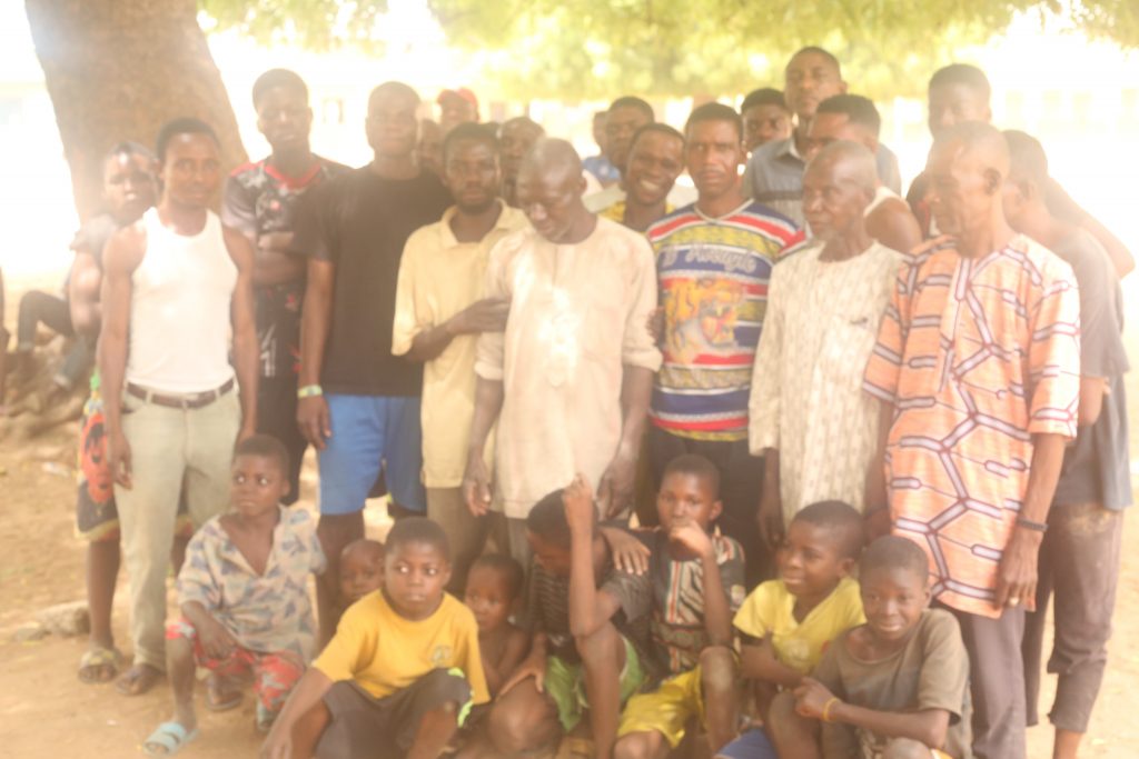 Men and children of Sangida-Awe taking refuge at a primary school