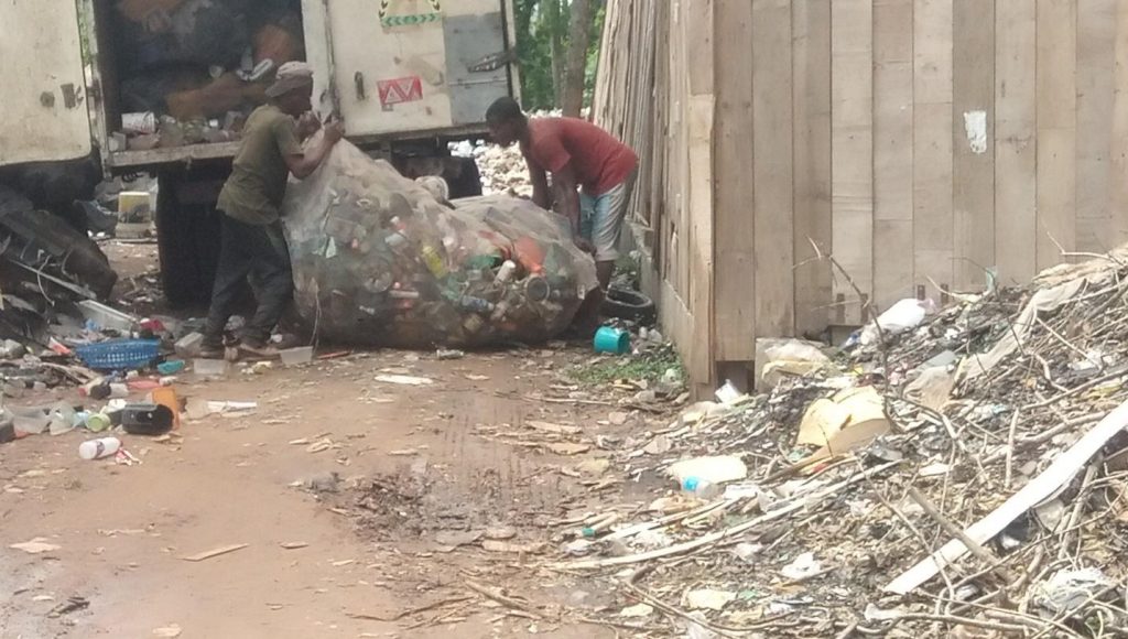 Waste arriving from dumpsites being moved by the scavengers