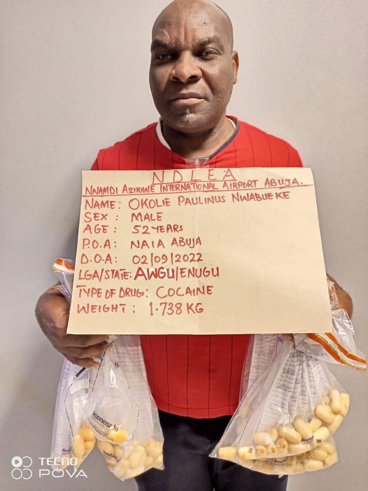 Okolie Paulinus Nwabueze with the cocaine he imported.