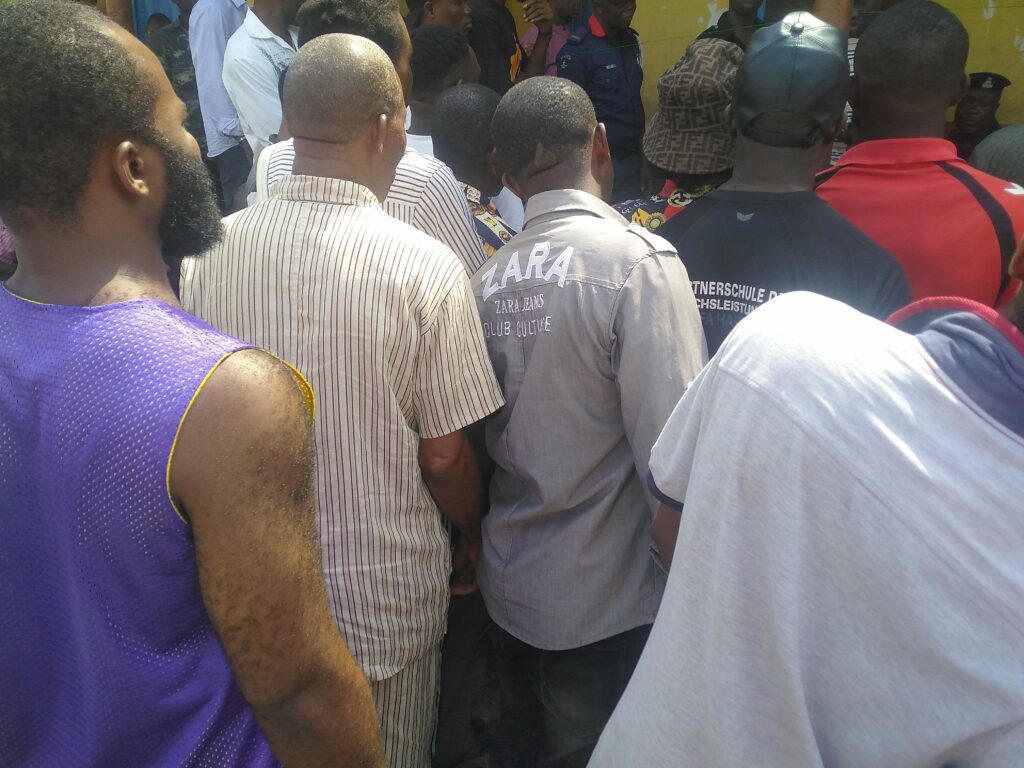 Victor in the crowd. waiting to get their PVC. PHOTO CREDIT: Joseph Adeiye |FIJ