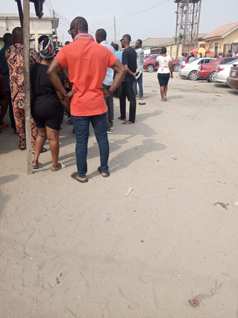 People waiting for INEC officials to arrive for their PVC collection.