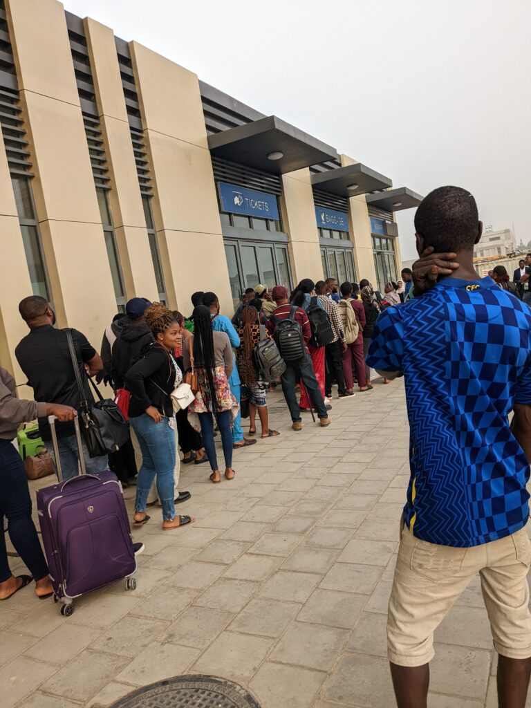 Travellers waiting in line for tickets. Photo Credit: Opeyemi Lawal/FIJ