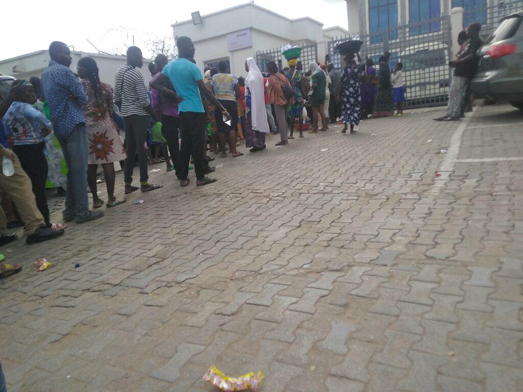 Customers waiting to withdraw cash
