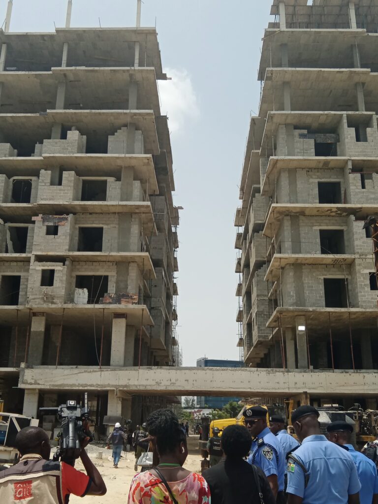 Back view of eight-storey construction adjacent to the rubble
