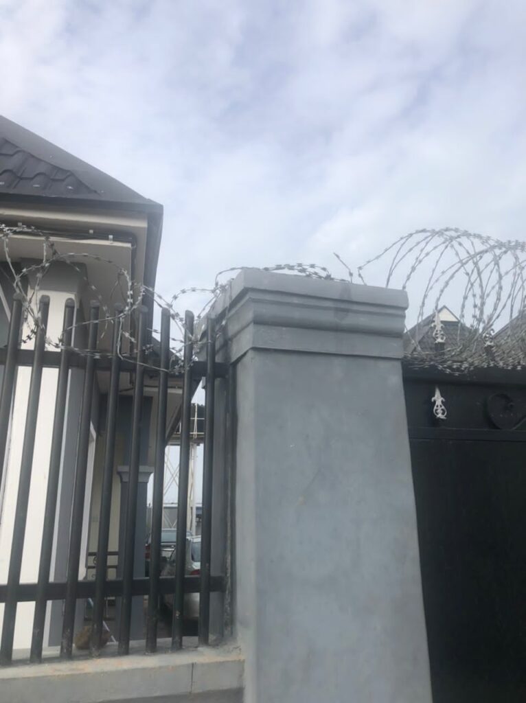 The gate EFCC officials jumped over, barb wires destroyed 