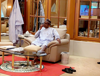 Muhammadu Buhari picks teeth after meal on February 27, 2019.