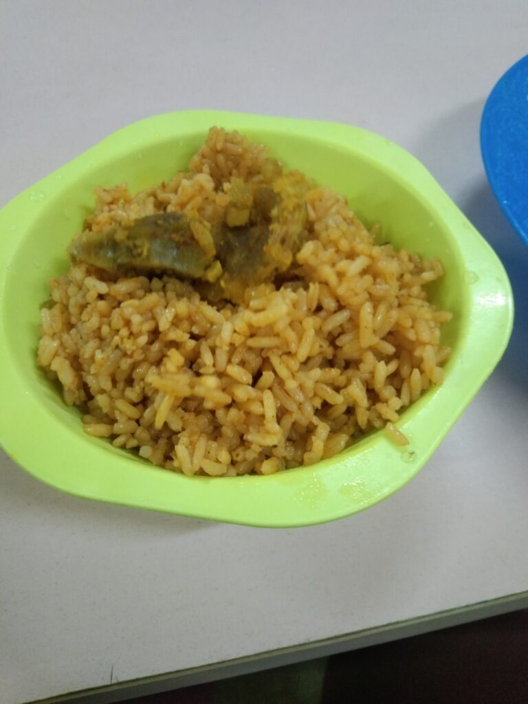 A plate of N200 rice and N100 meat I bought at the canteen