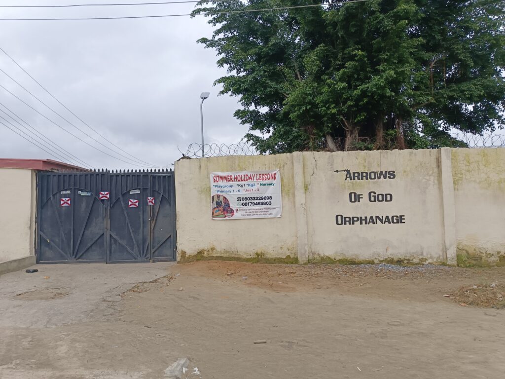 Seal on the gates of Arrows of God Orphanage along Oke Ira Nla Road, Ajah, Lagos. 