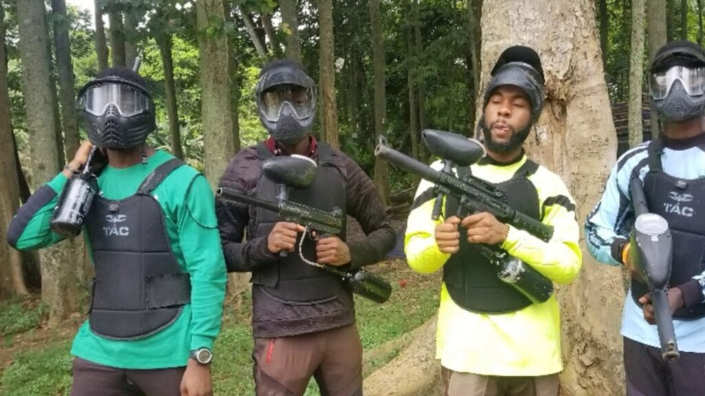 Paintball lovers holding up some paintball markers in Lagos