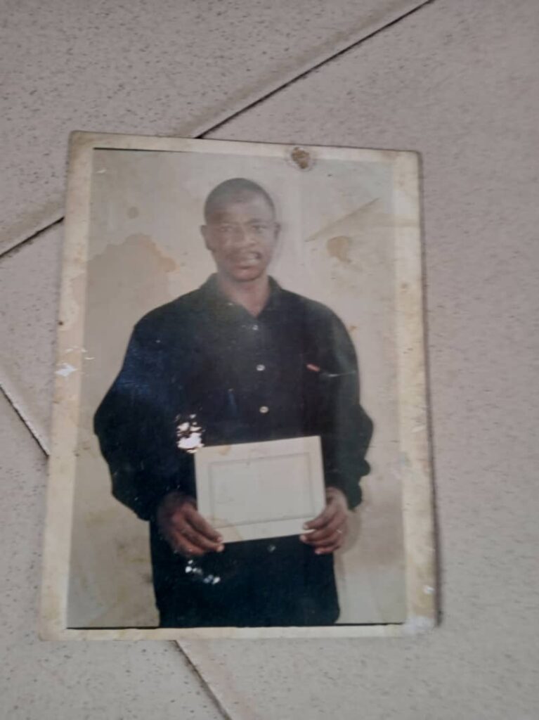 Jelili Oseni Holding the Commendation Certificate He Bagged in 2003