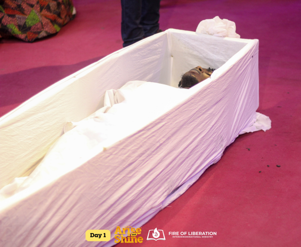 The supposed dead man in a casket